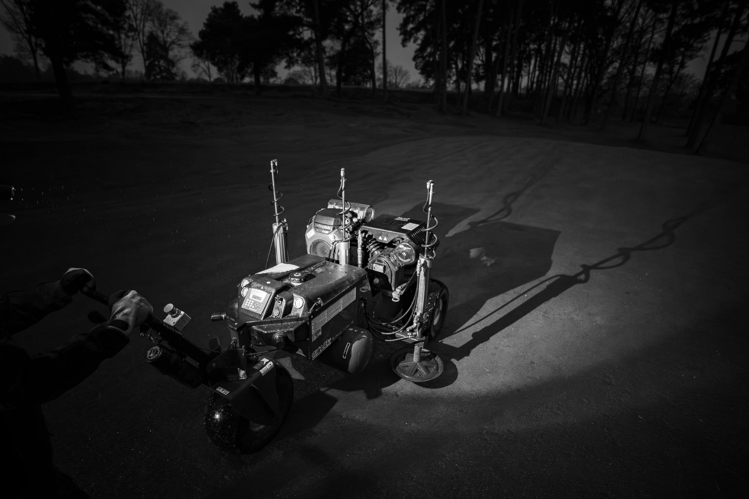 The AIR2G2 casting long shadows across the green before sunrise