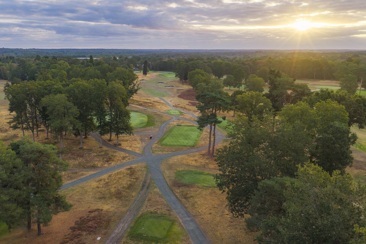 Aerial view down the avenue of the course at sunrise