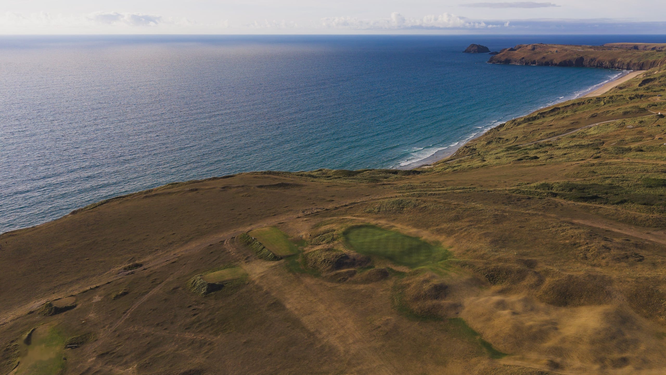 Aerial view along the dunes and the coastline beyond