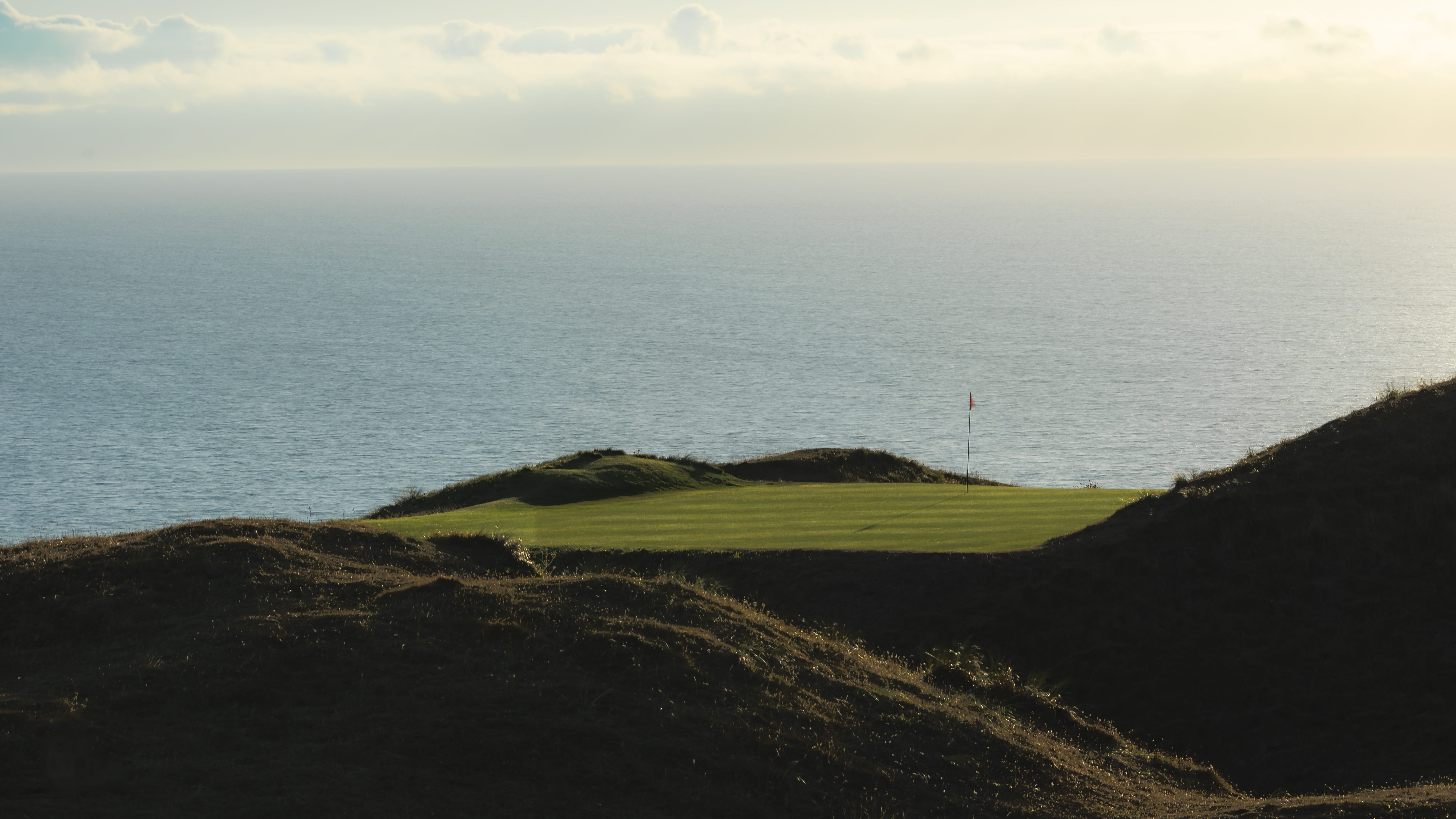 Duneland fairways under a wide sky