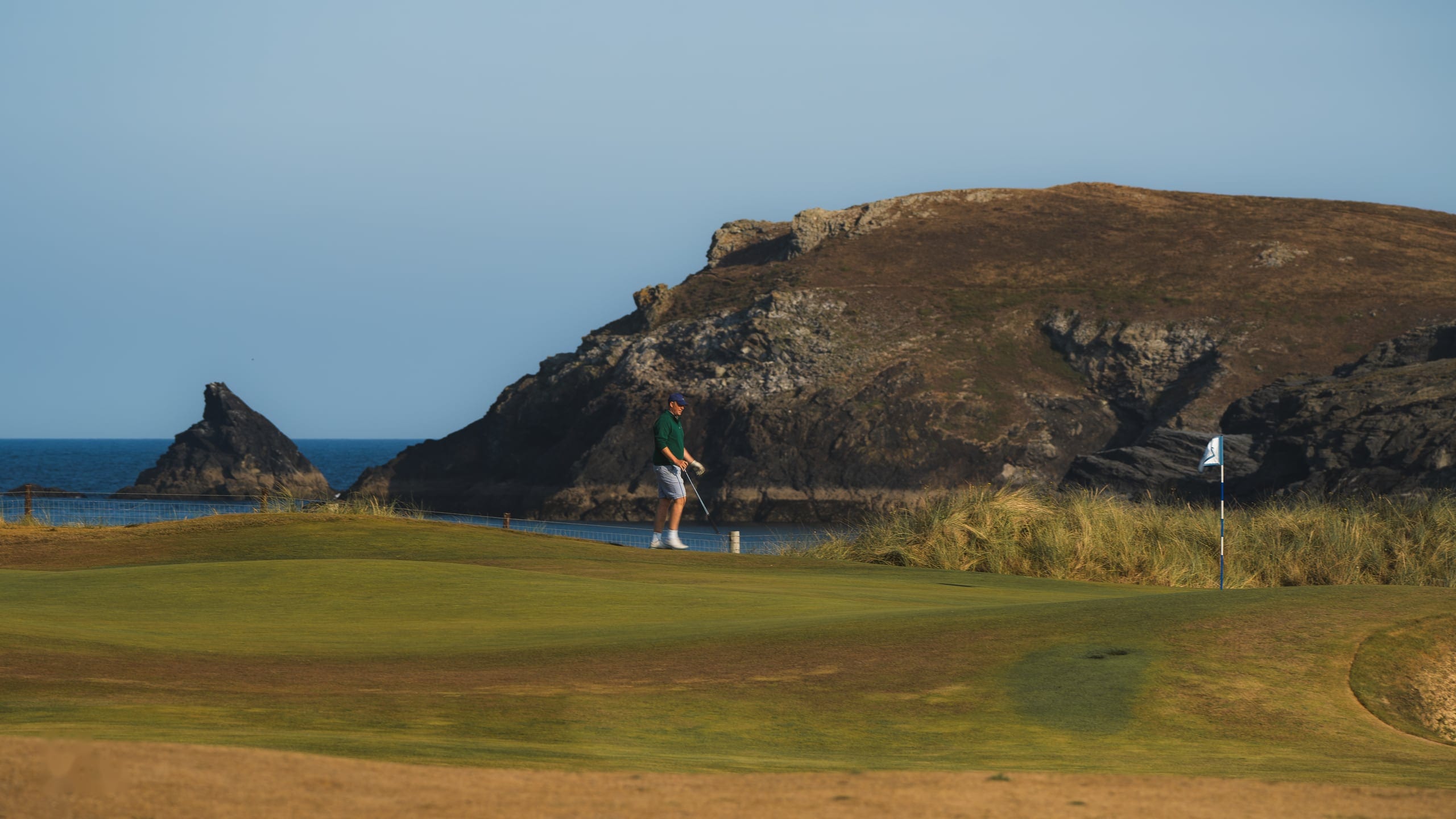 Aerial view of the coastline and the course above it