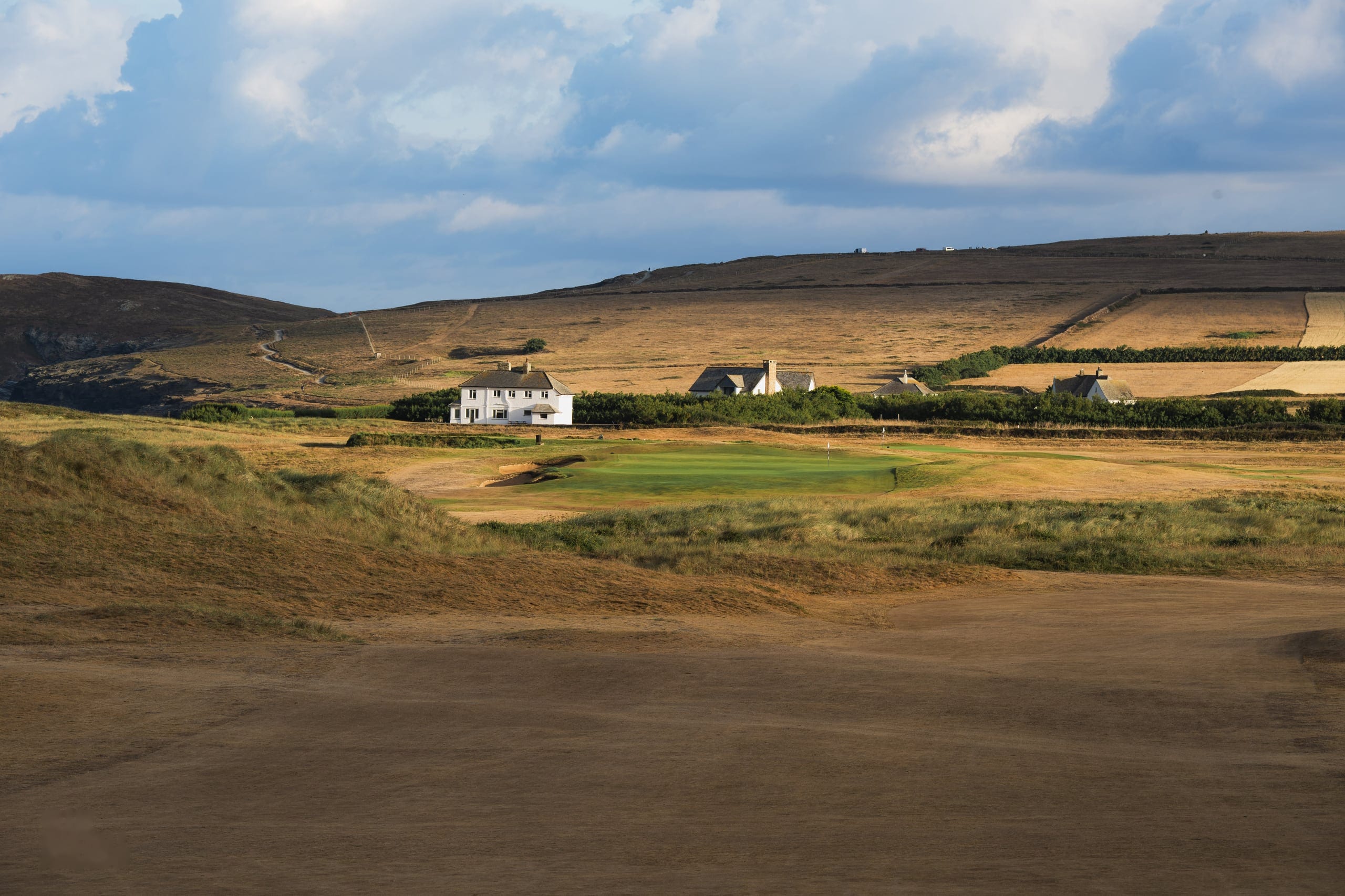 Links holes running past the cottages towards the headland