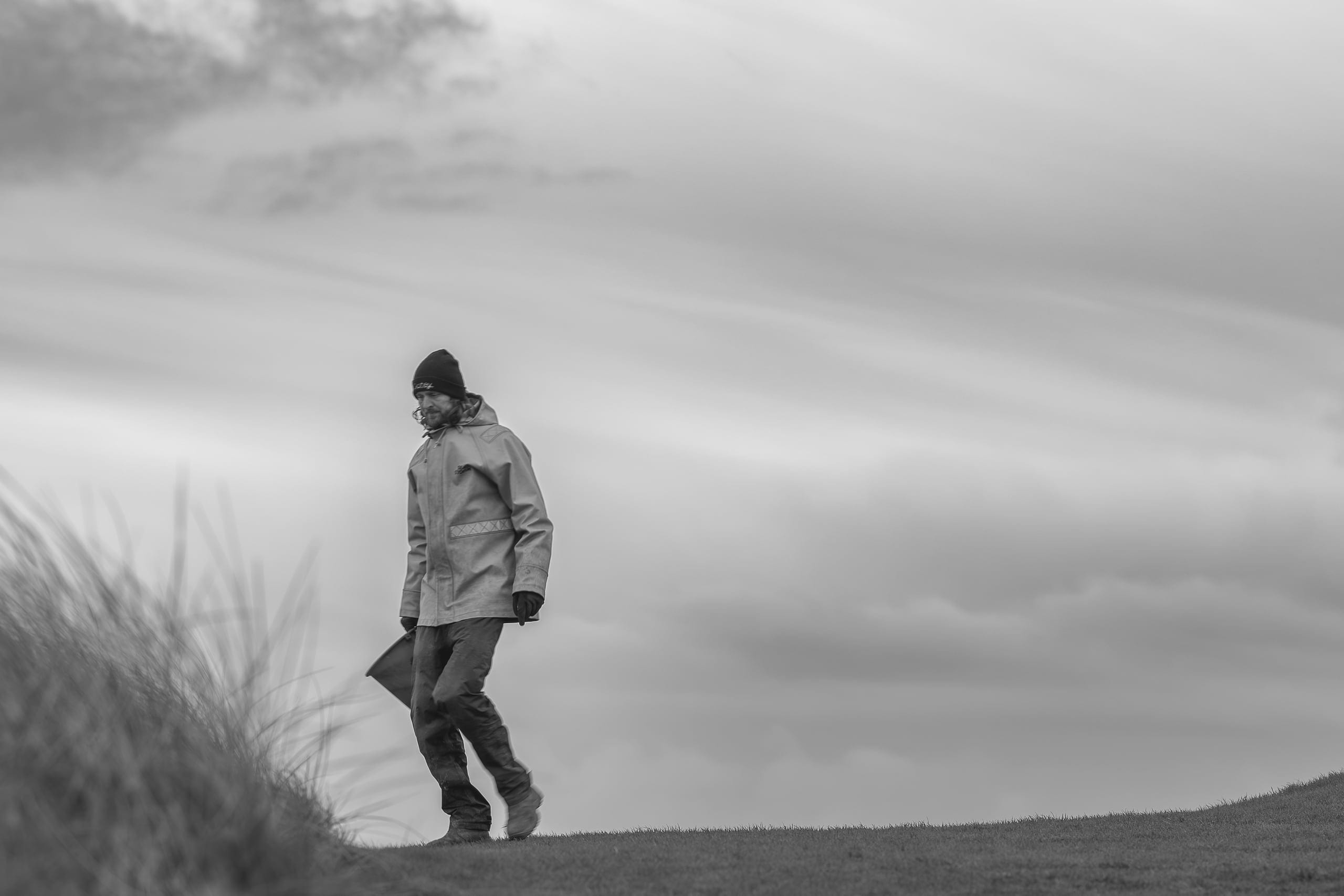 Phil Taylor, greenkeeper at Trevose, walking the dunes